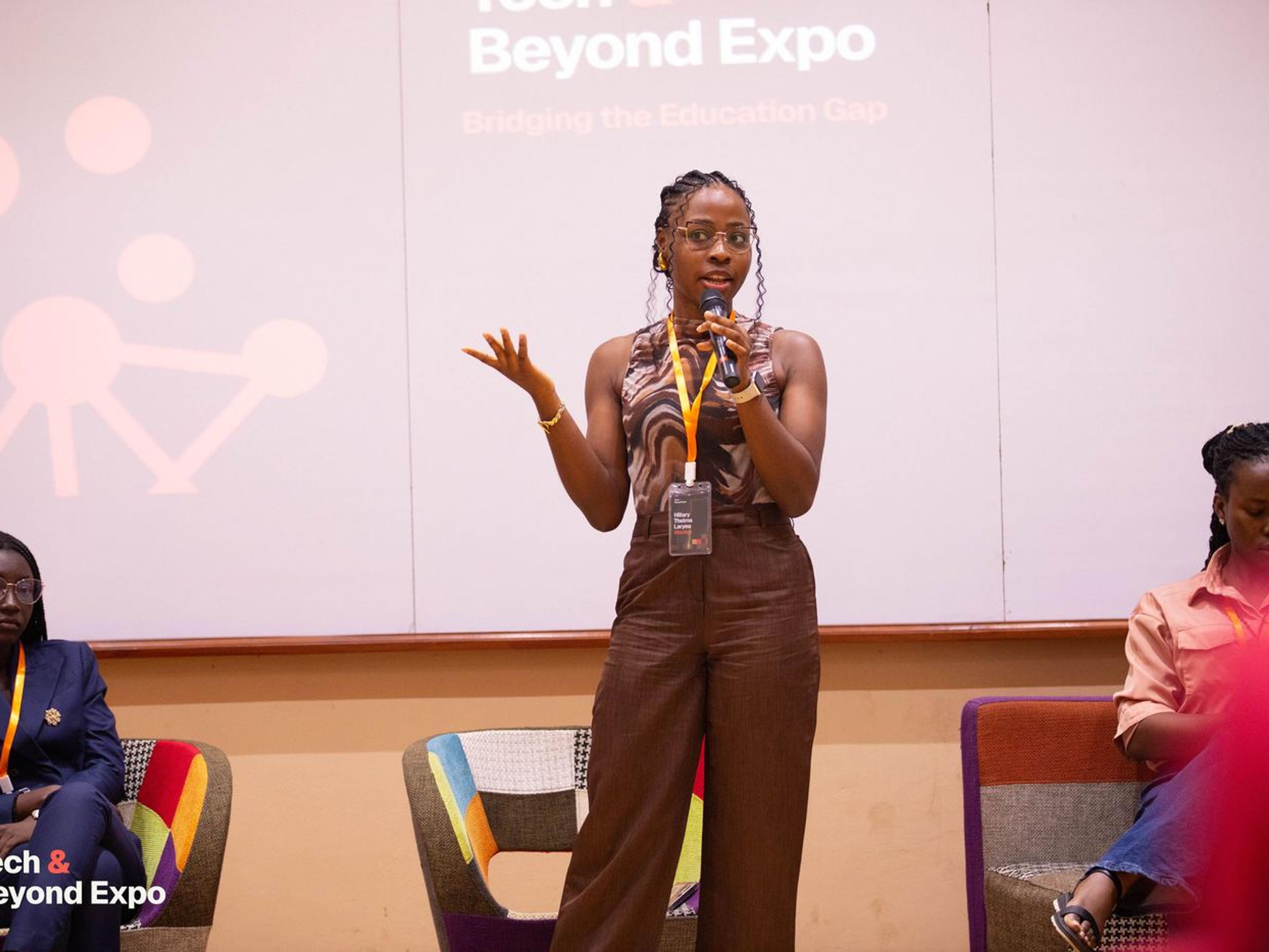 A speaker addressing the audience from the stage