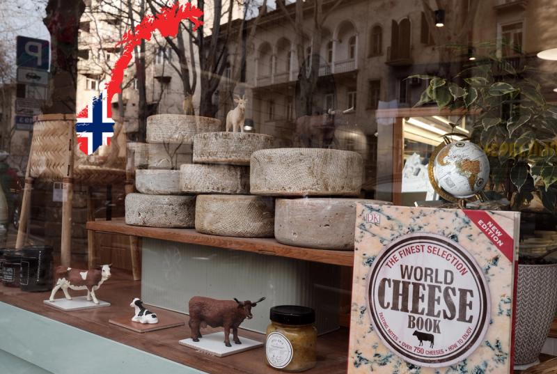 Cheese shop window, cookbook, globe and flag of Norway
