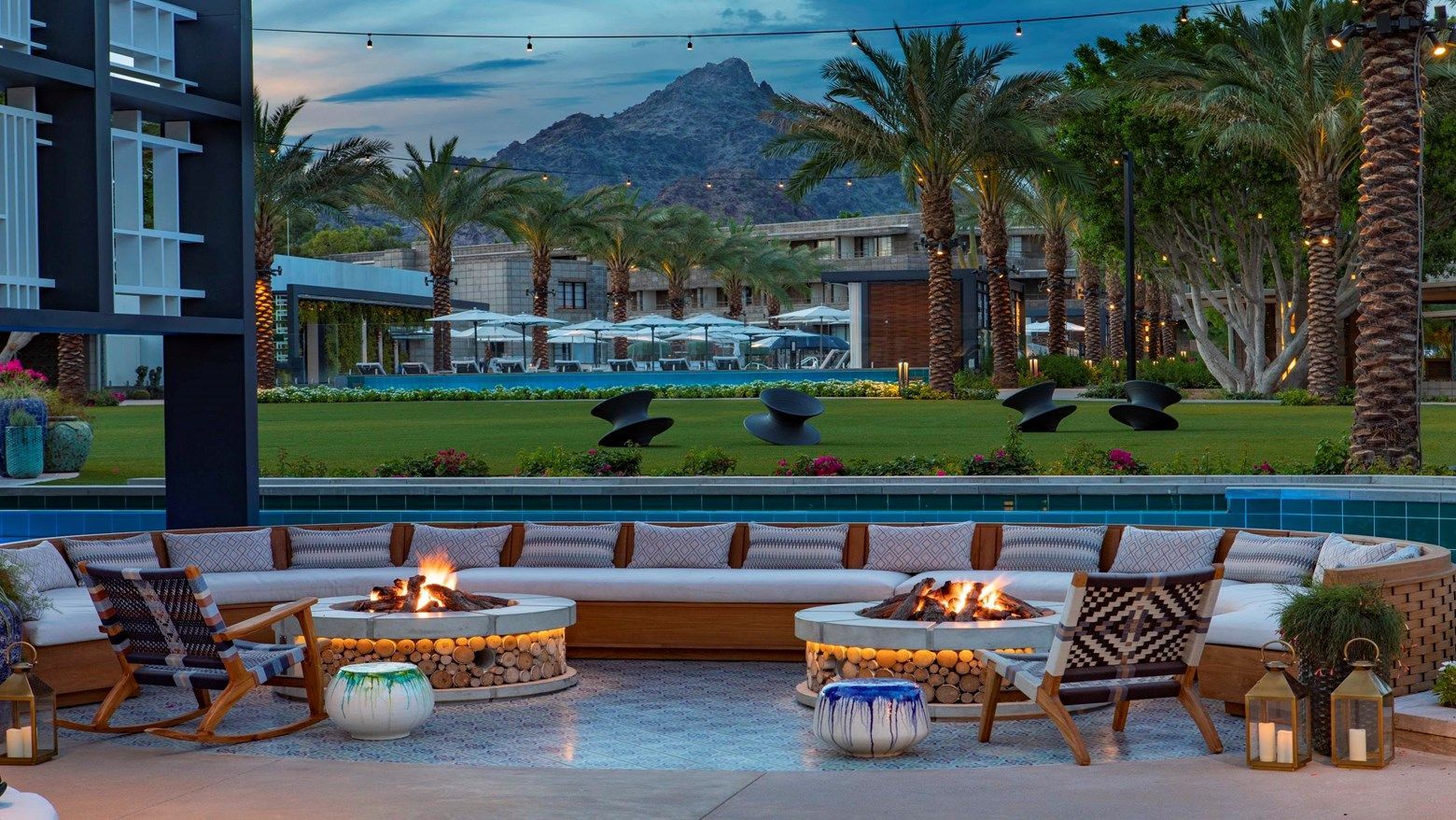 Outdoor fire pits and lounge seating in the resort gardens