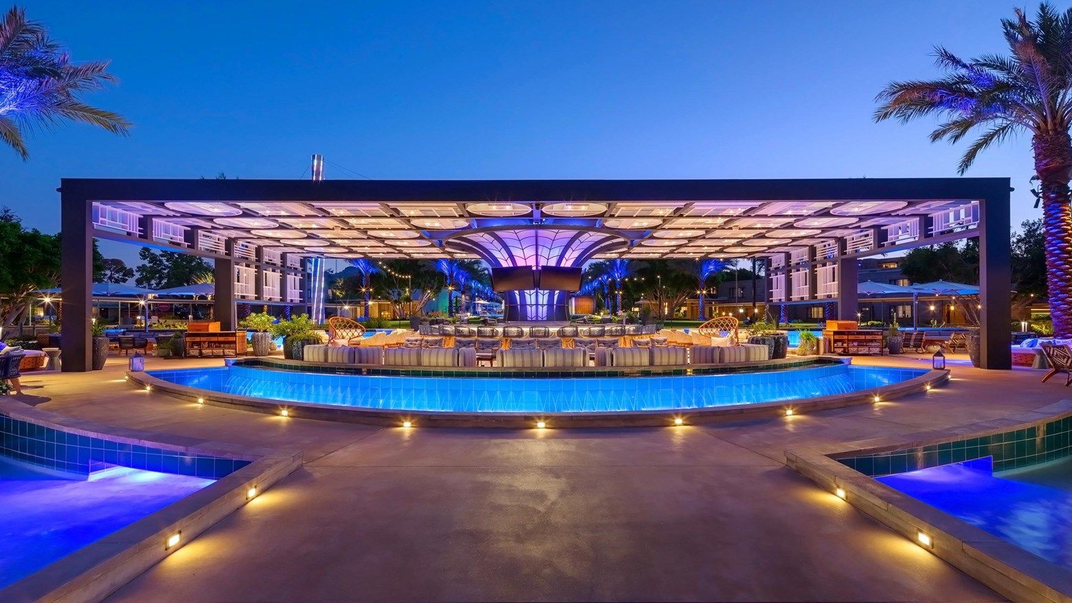 The Arizona Biltmore pool glowing blue at dusk