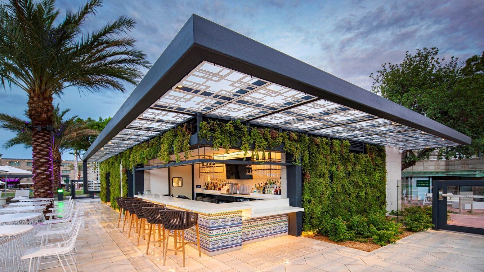 The Biltmore's rooftop bar framed by a lush living wall