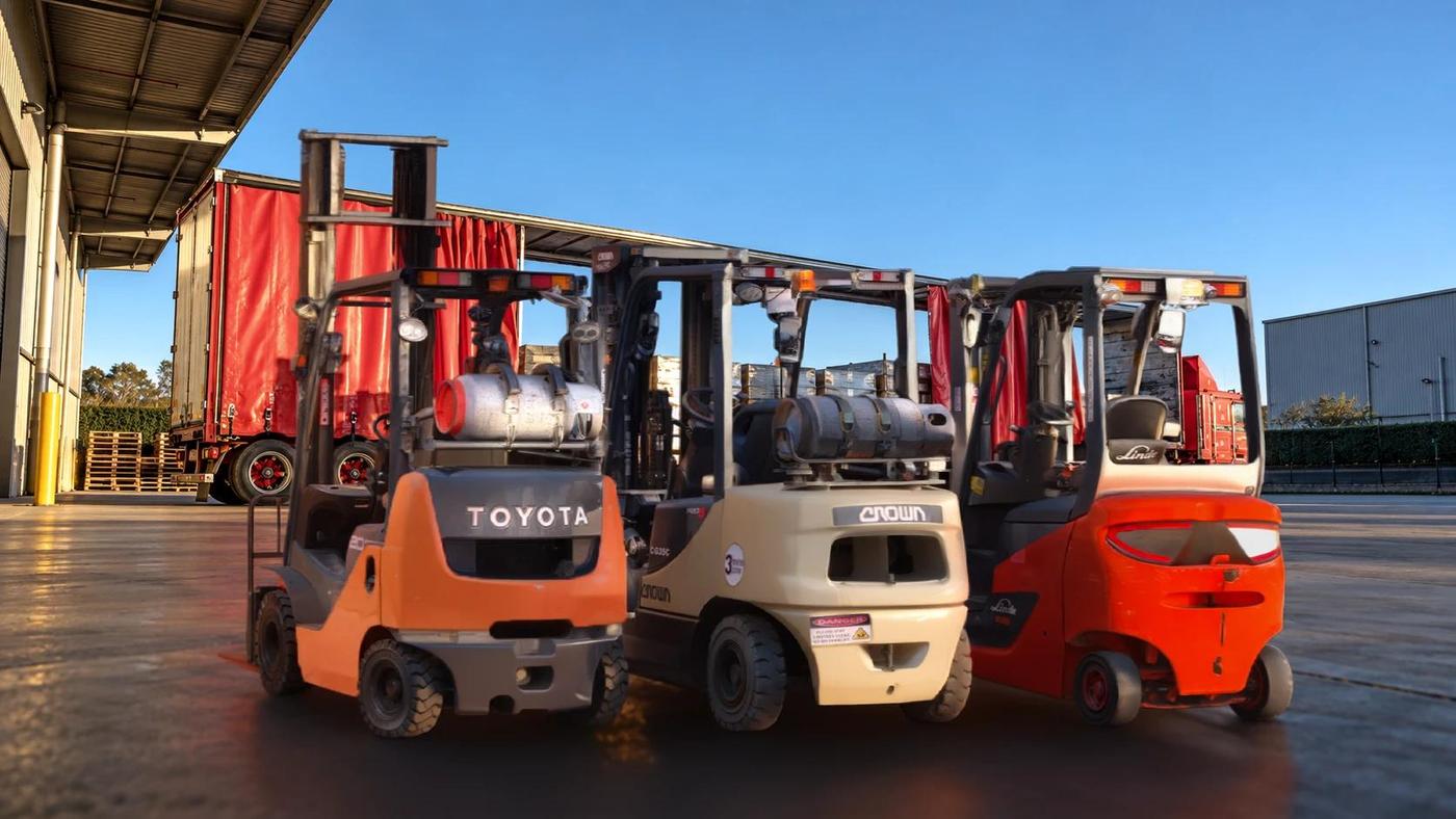 Toyota, Crown and Linde forklifts in the yard