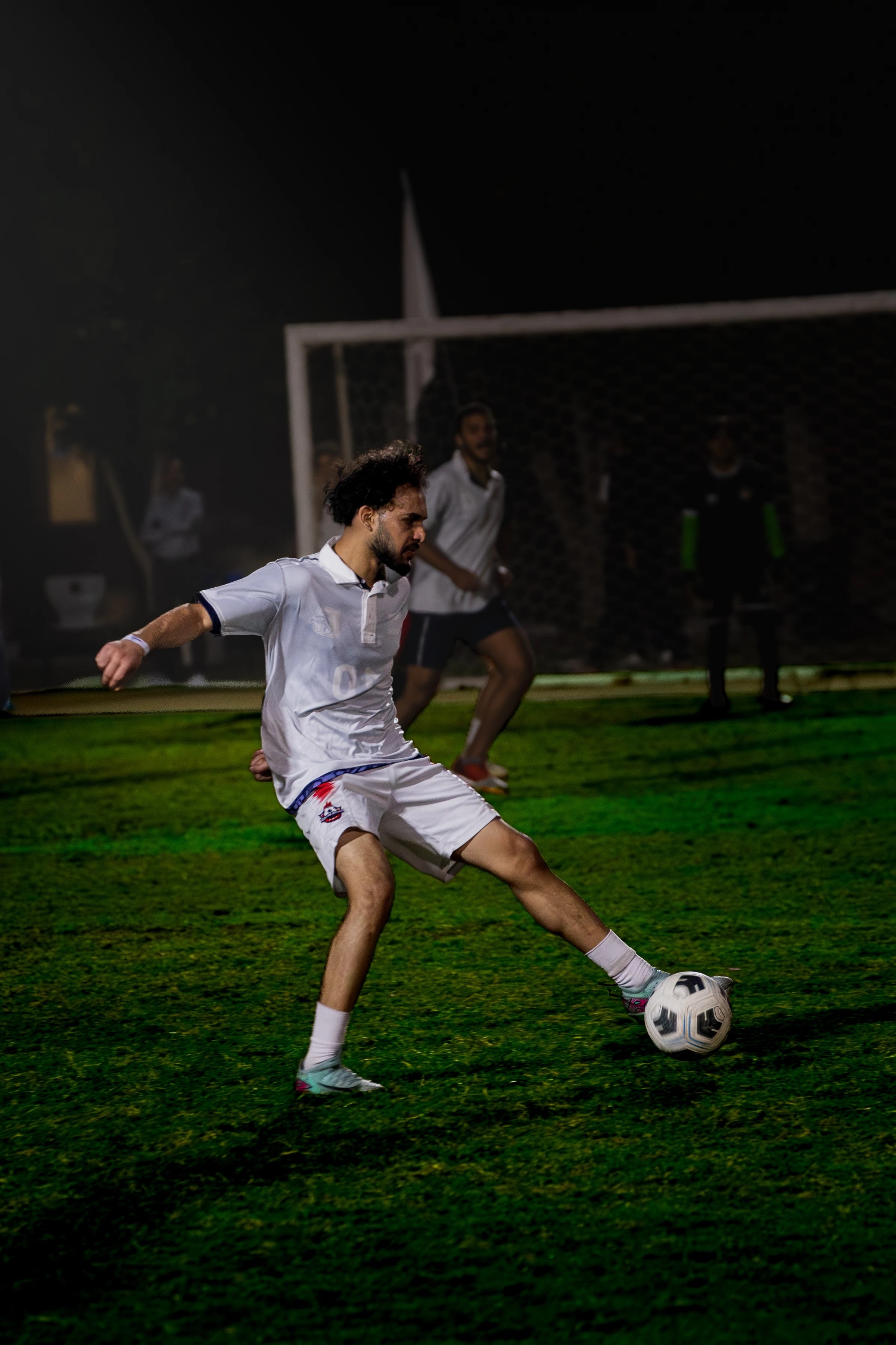 Football player striking the ball
