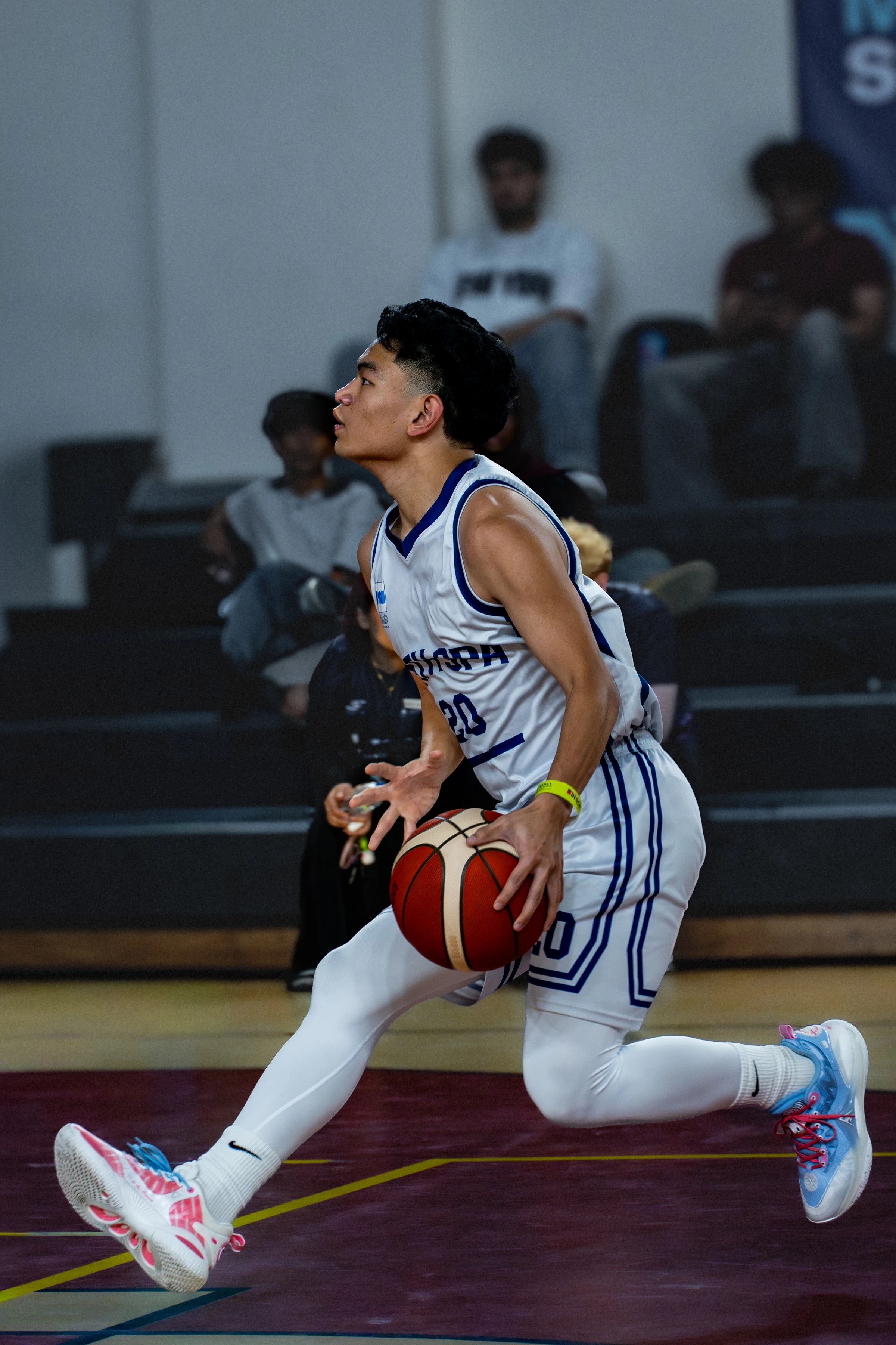 Basketball player moving toward the basket