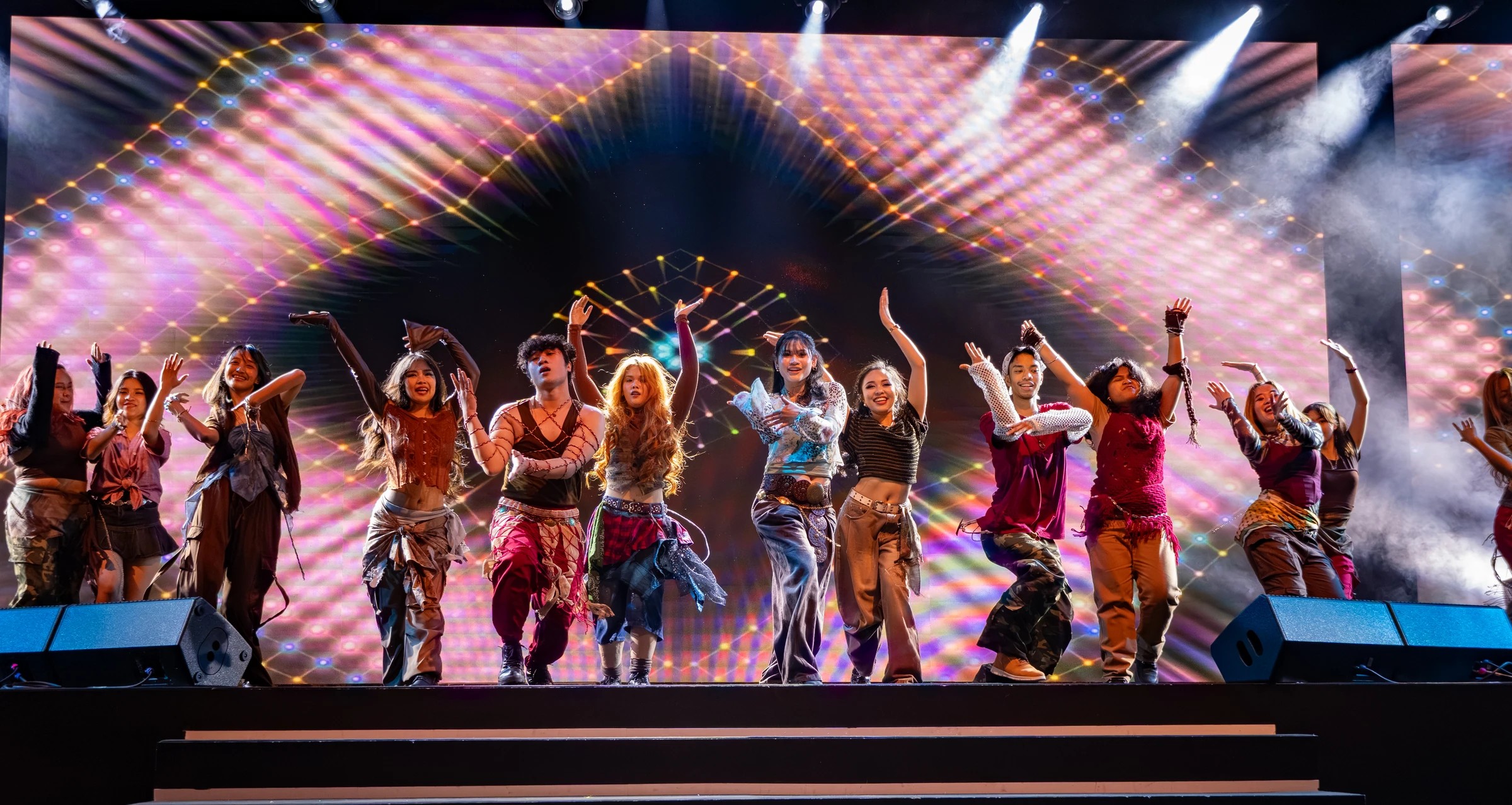 Dance ensemble beneath a colourful stage canopy at Kalayaan 2026