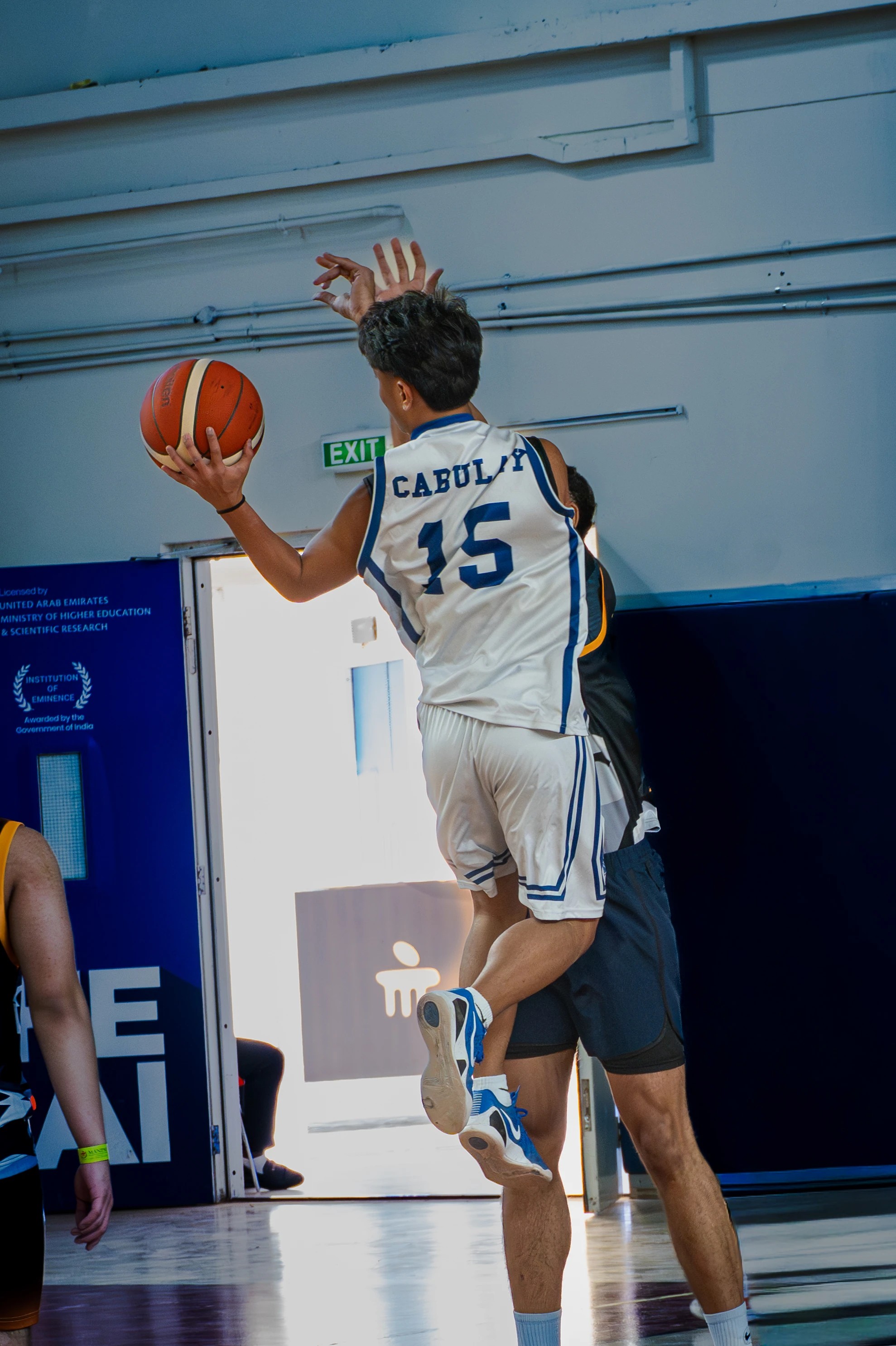 Basketball player rising toward the basket