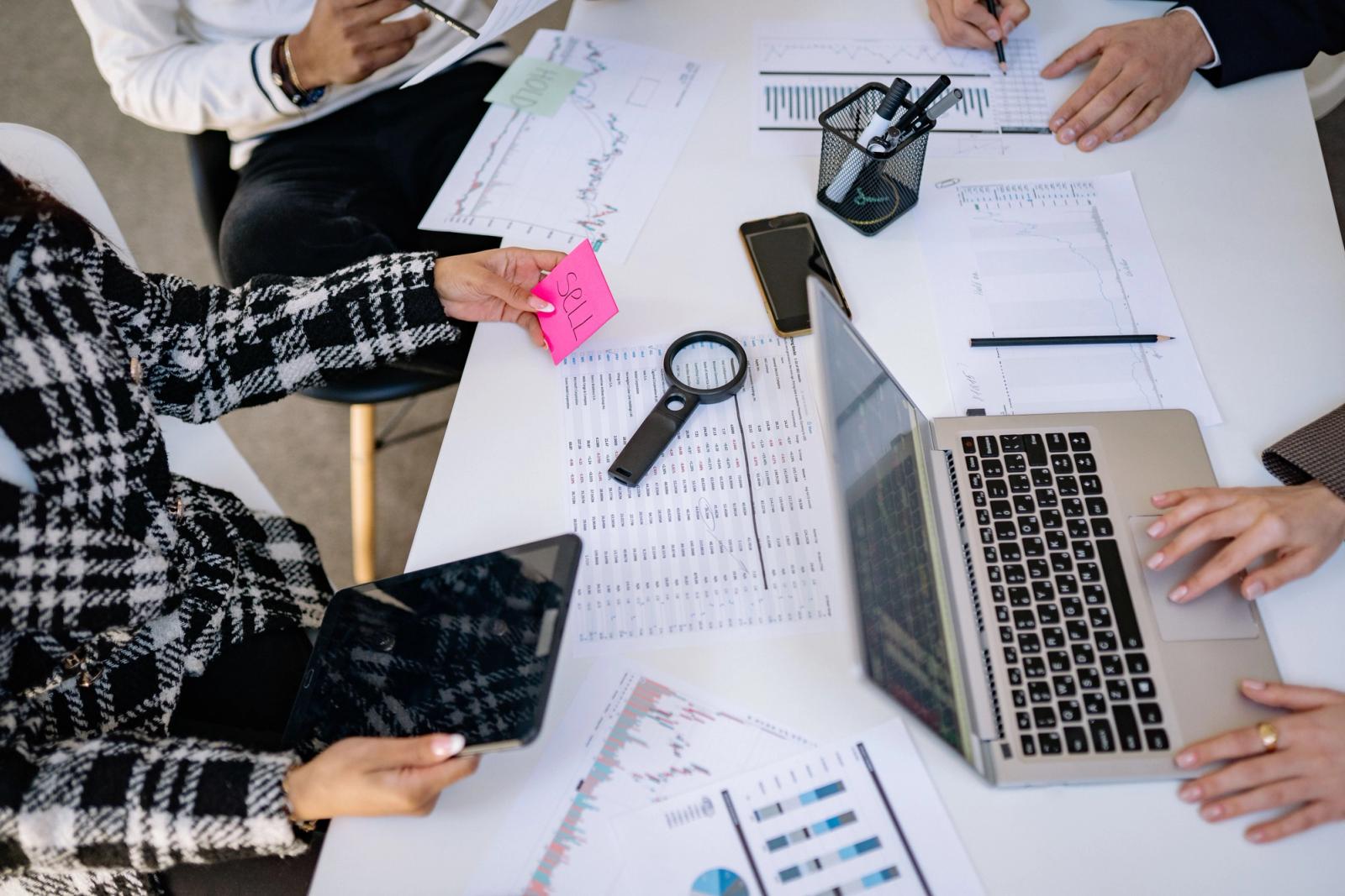 Marketing team collaborating around analytics data