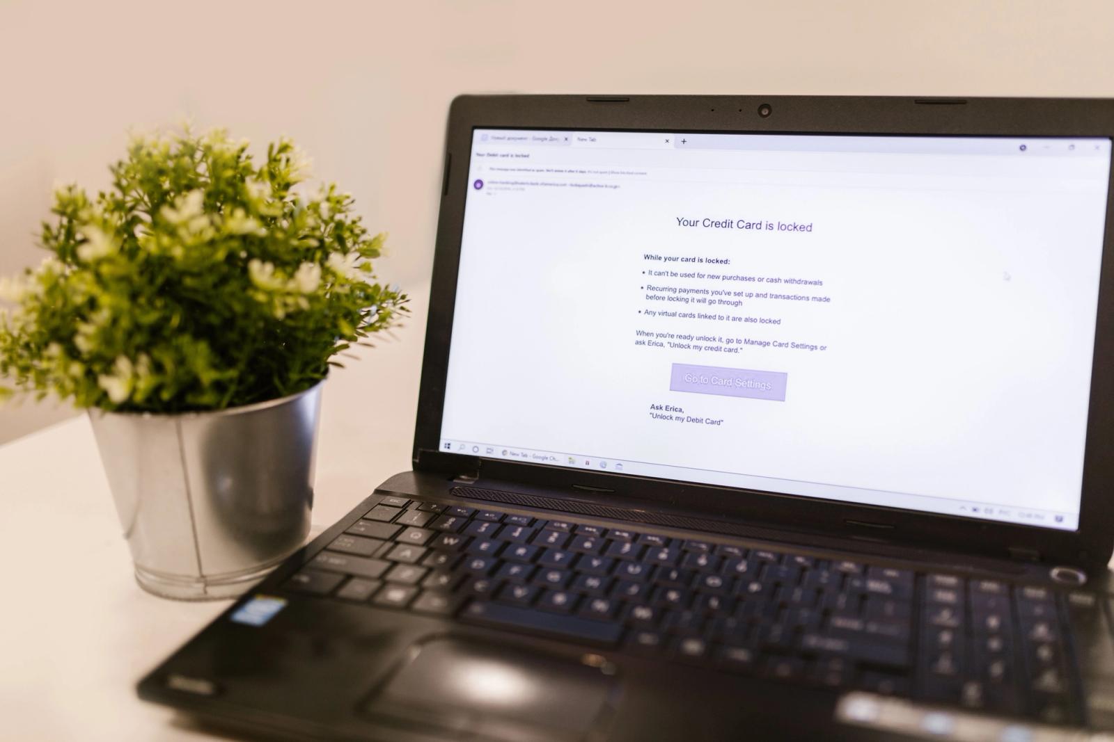 Laptop workspace for comparing email marketing platforms