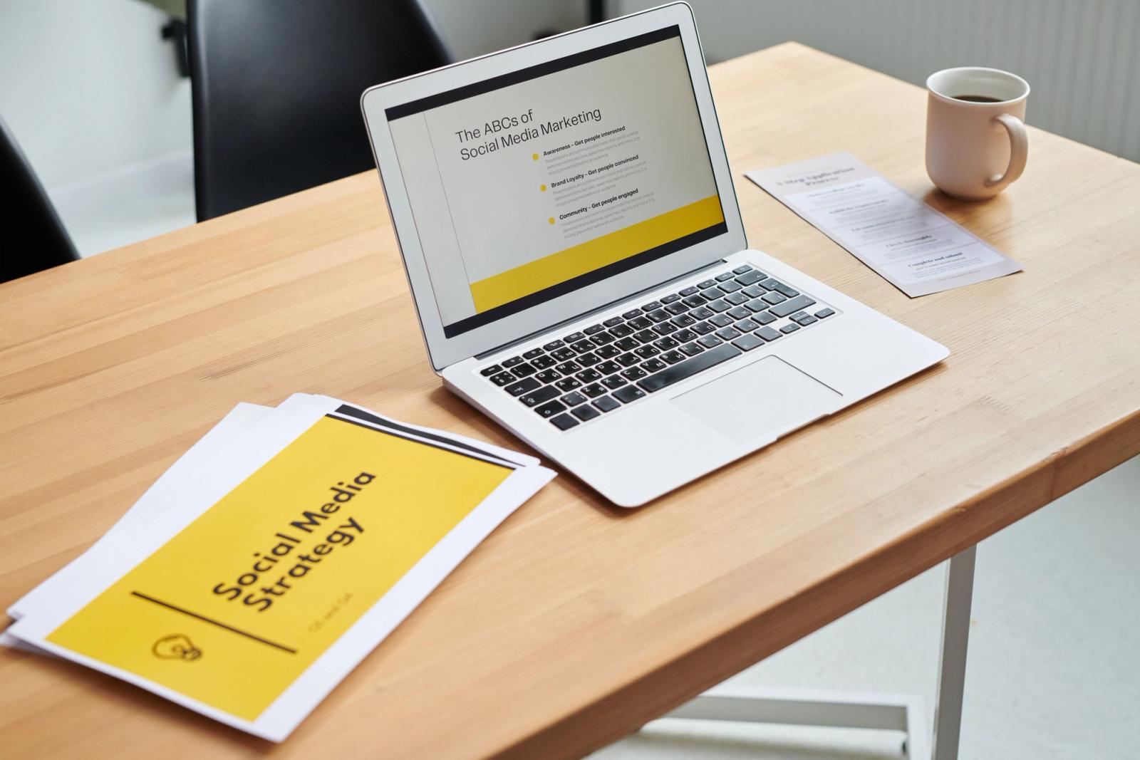 Laptop and documents in a content marketing strategy workspace