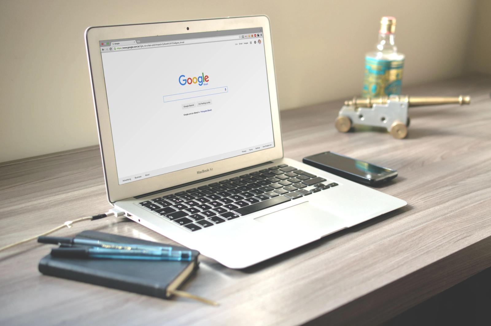 Laptop workspace showing a search engine and digital strategy tools