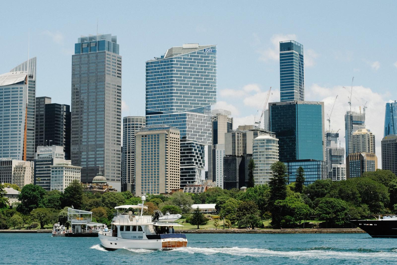 Sydney harbour skyline with modern skyscrapers under a clear blue sky