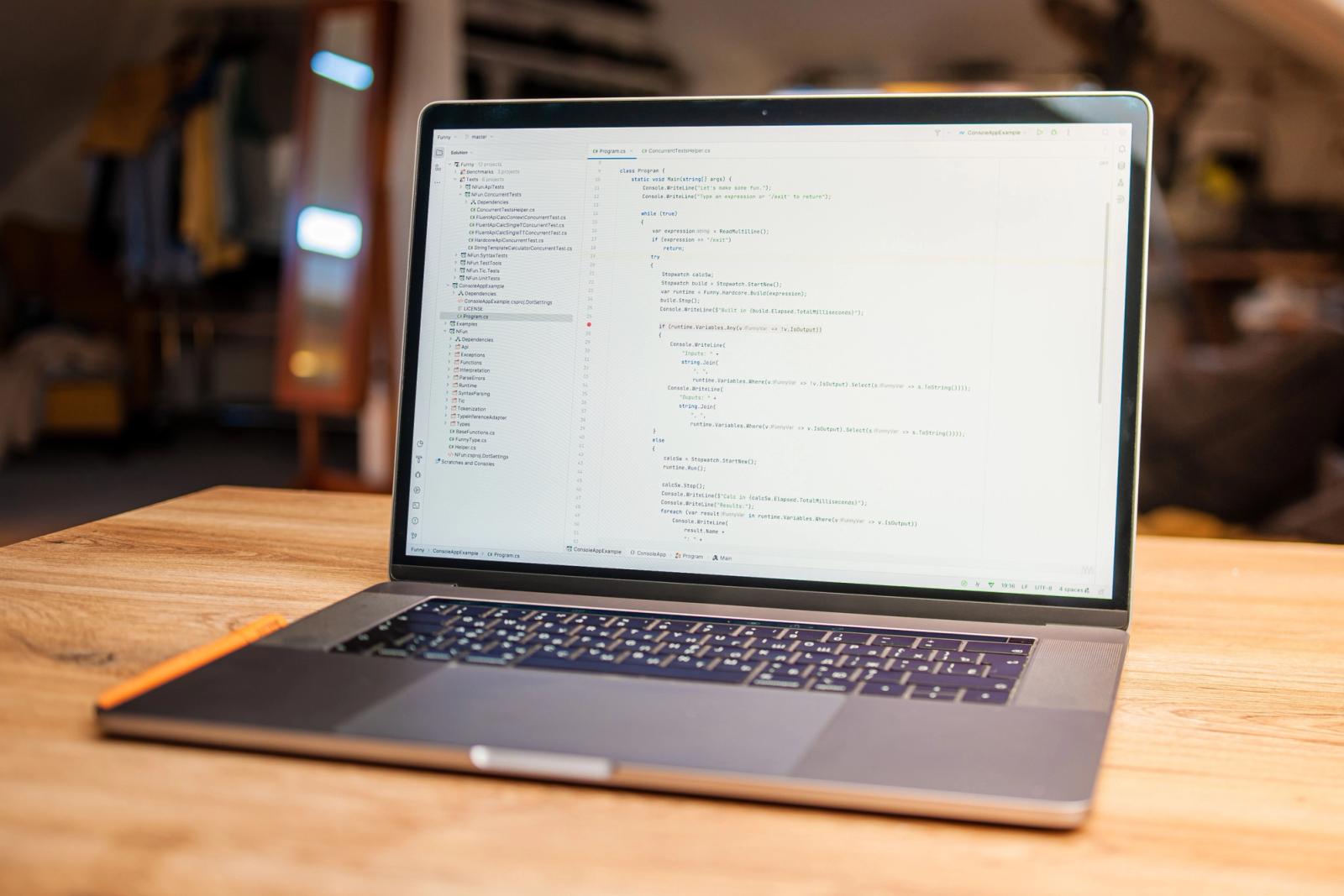 Laptop showing code in a modern website development workspace