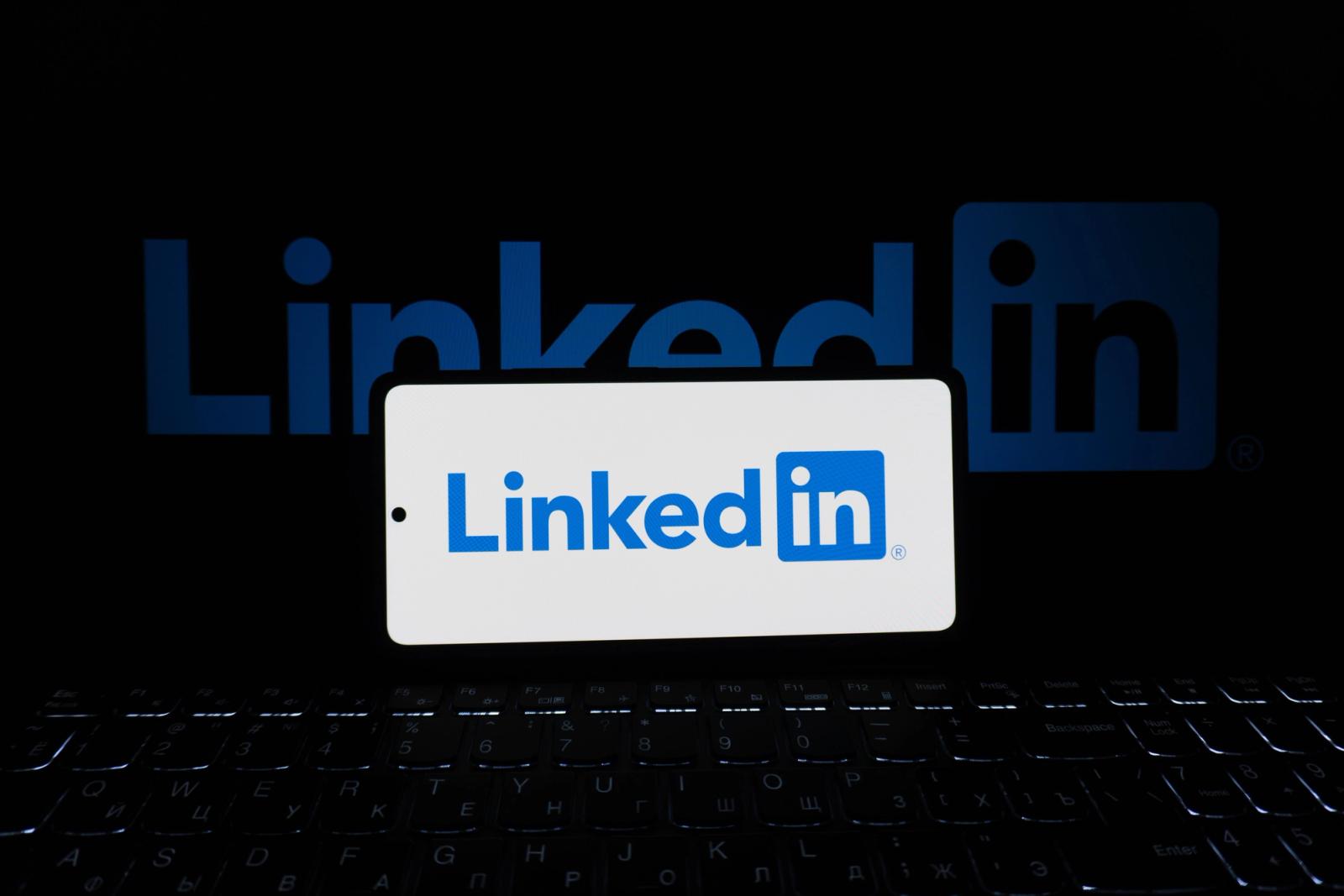 Smartphone and laptop representing social media platform management