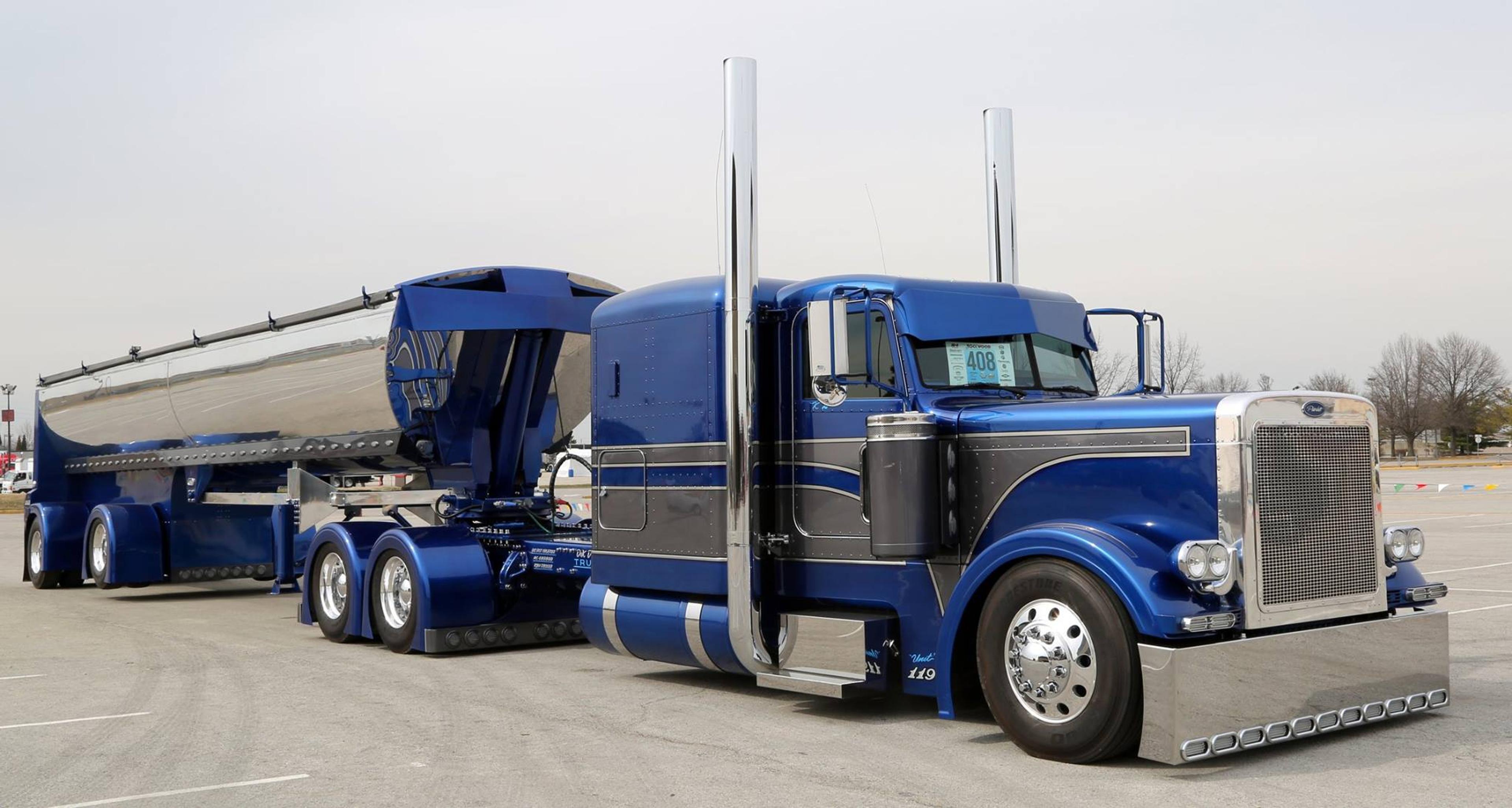 A Semi-truck with Moto Mirrors on the sides.