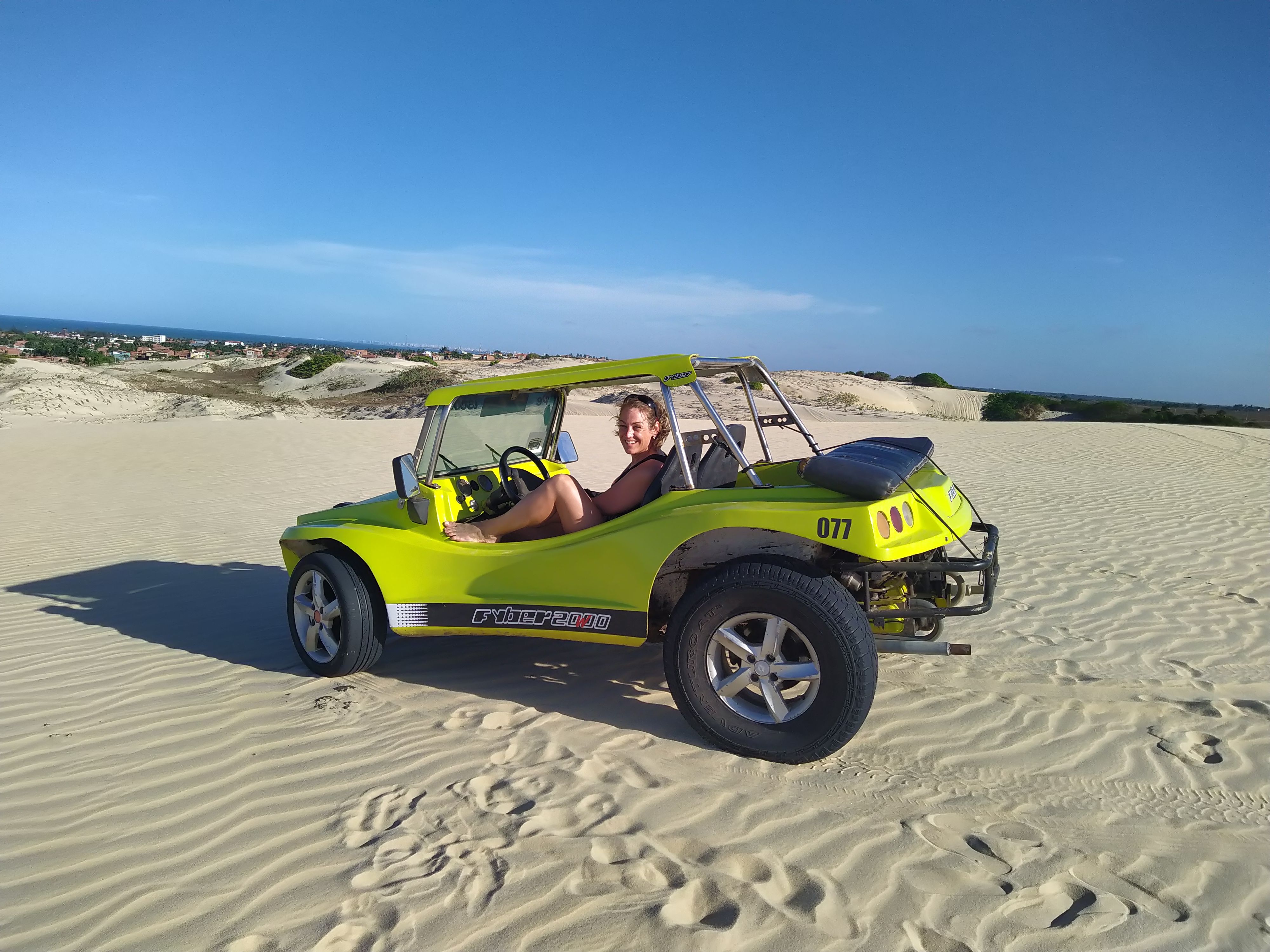 Dune buggy driving through sand dunes in Brazil