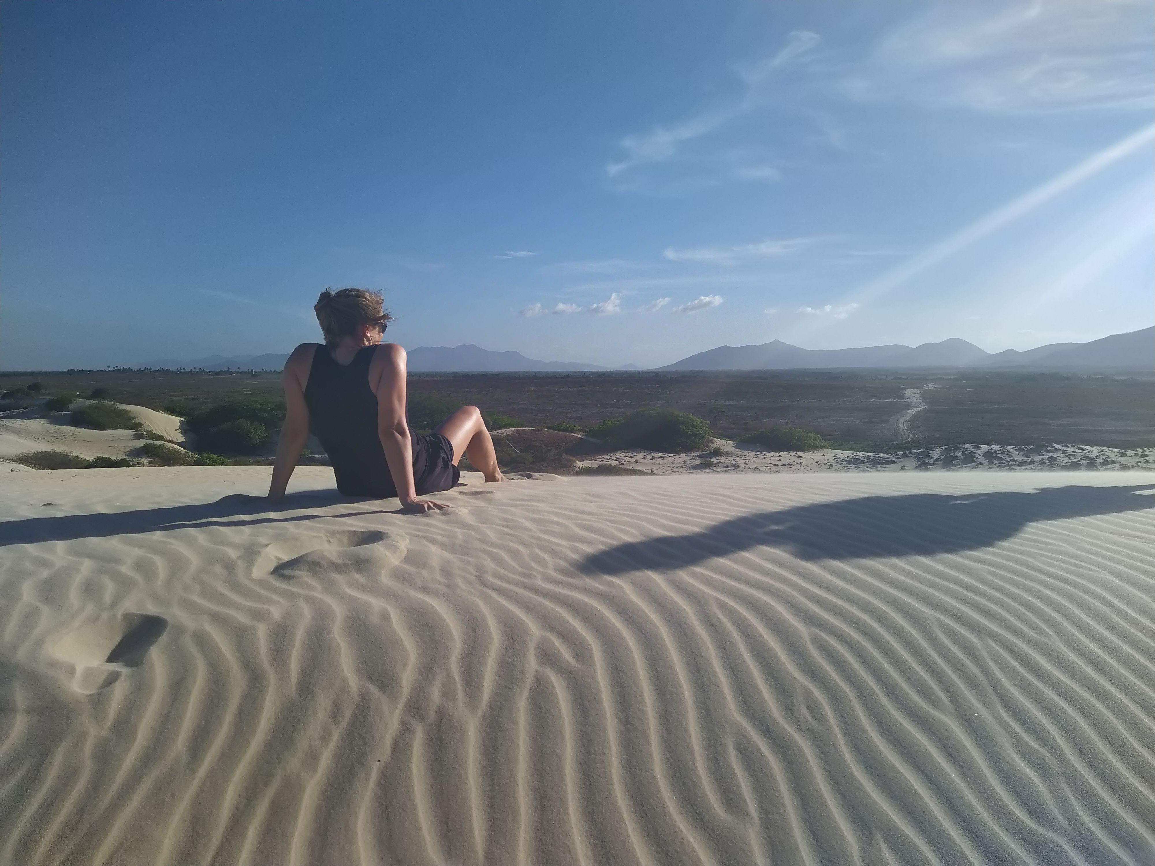 Sitting in sand dunes in Brazil