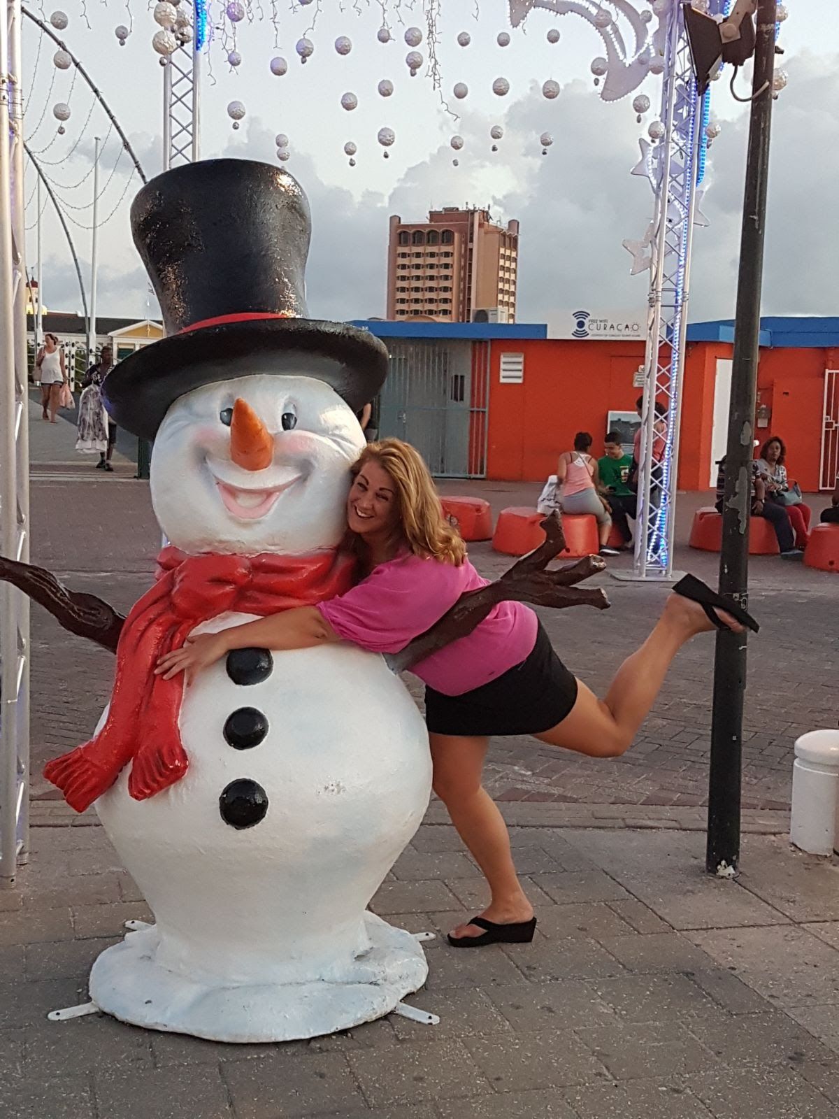 Posing with snowman statue in Willemstad Curaçao