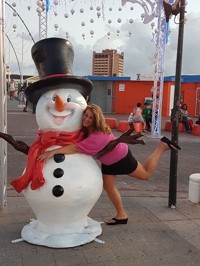 Posing with snowman statue in Willemstad Curaçao