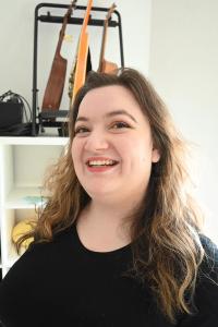 Leda Wolf with a wide smile on her face