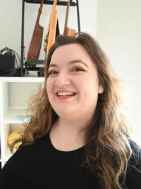 Leda Wolf with a wide smile on her face