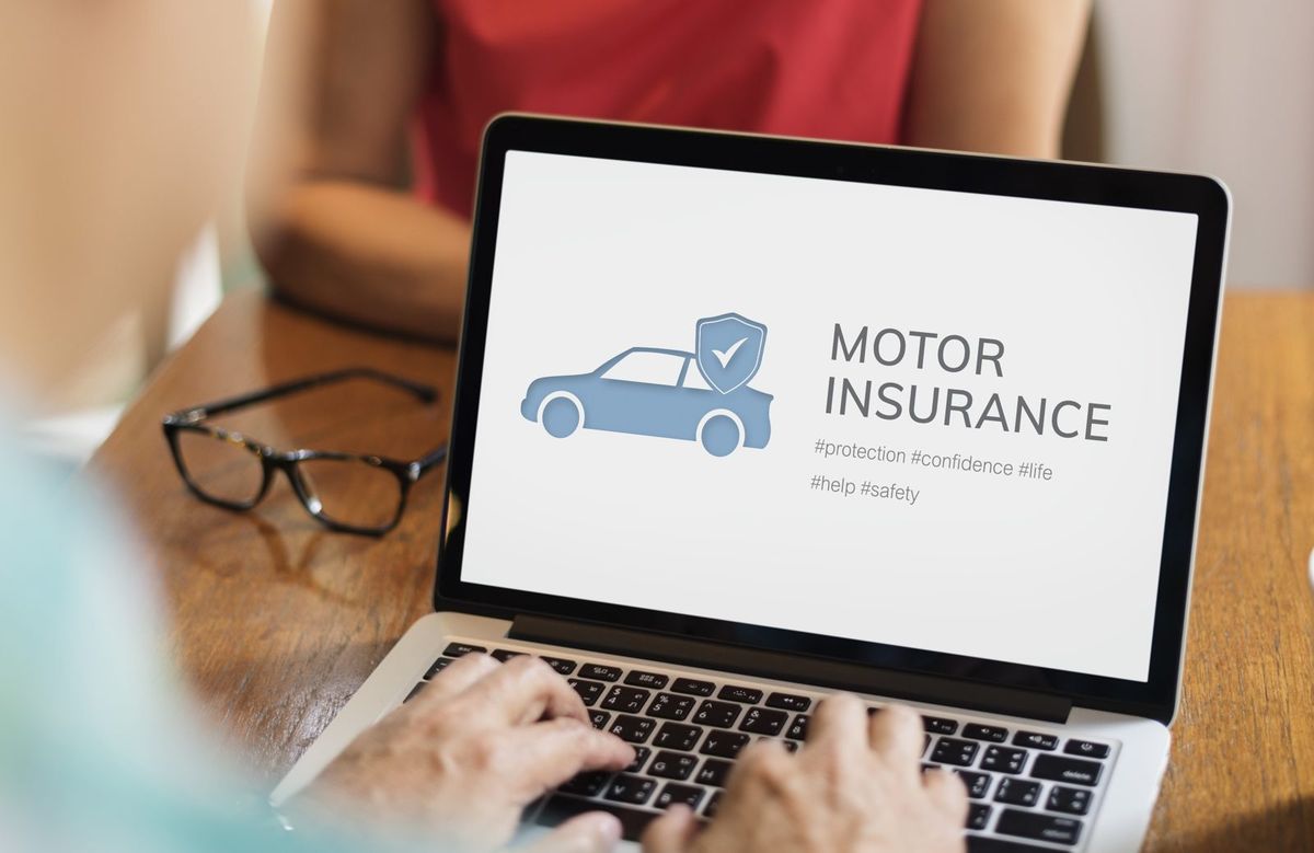 Motor insurance shown on a laptop as a customer reviews coverage