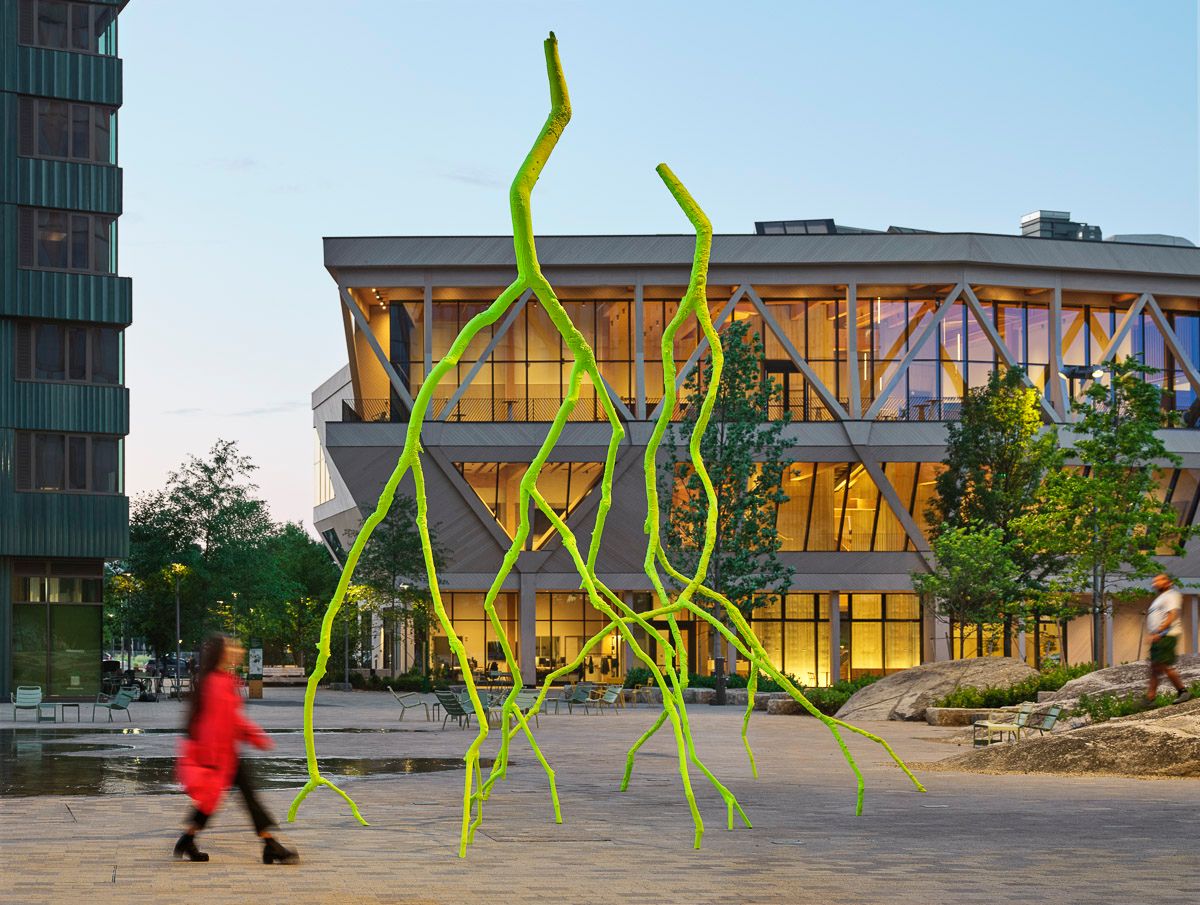 The image shows Ugo Rondinone’s monumental painted bronze sculptures titled “sublime light” and “blissful light” installed at Harvard University's Enterprise Research Campus in Allston, Boston.
