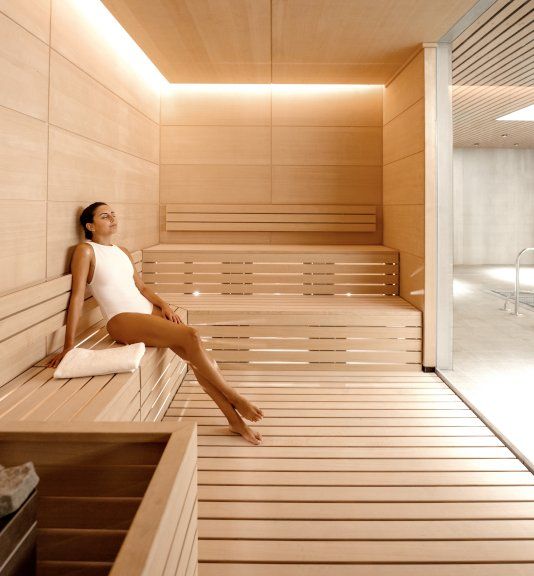 Luxurious Wellness Suite with heated lap pool, underwater speakers, cold plunge, steam room, sauna, and treatment rooms