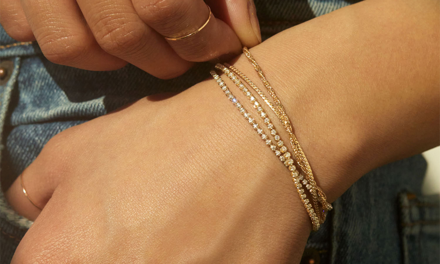 A set of Catbird tennis bracelets on a wrist
