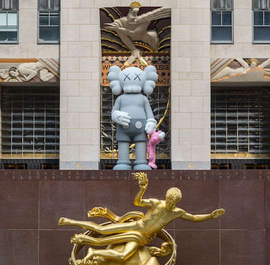SHARE sculpture by artist KAWS on Center Plaza