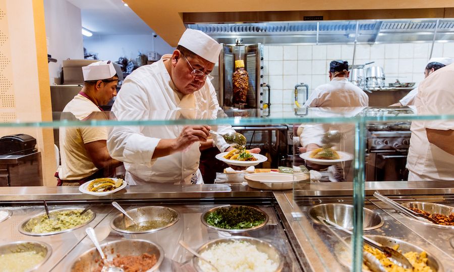 Chef preparing food at Puya Tacos de Puebla at Rockefeller Center