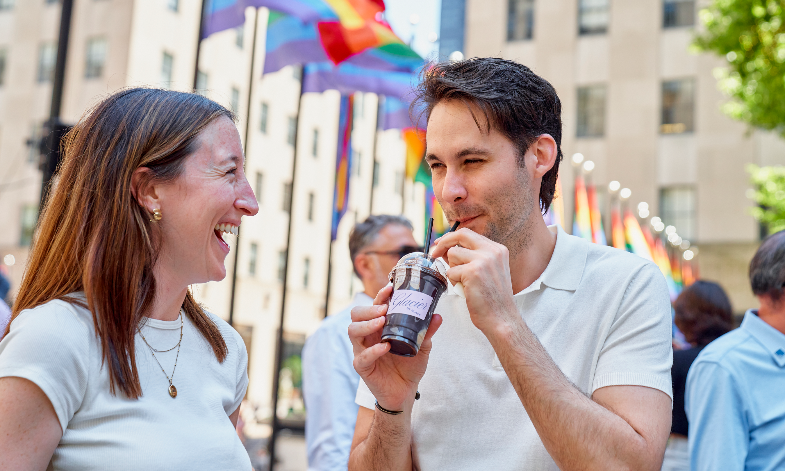 Two people sharing a frozen hot chocolate from Glace at Rockefeller Center