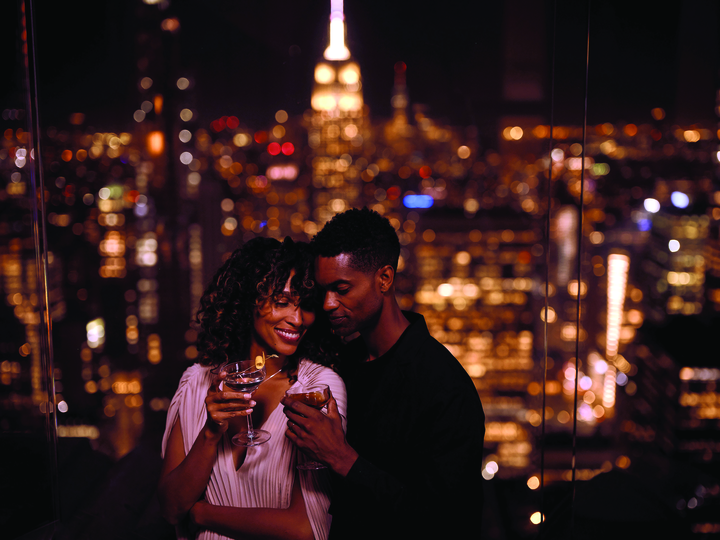 Couple getting drinks at Top of the Rock at Rockefeller Center
