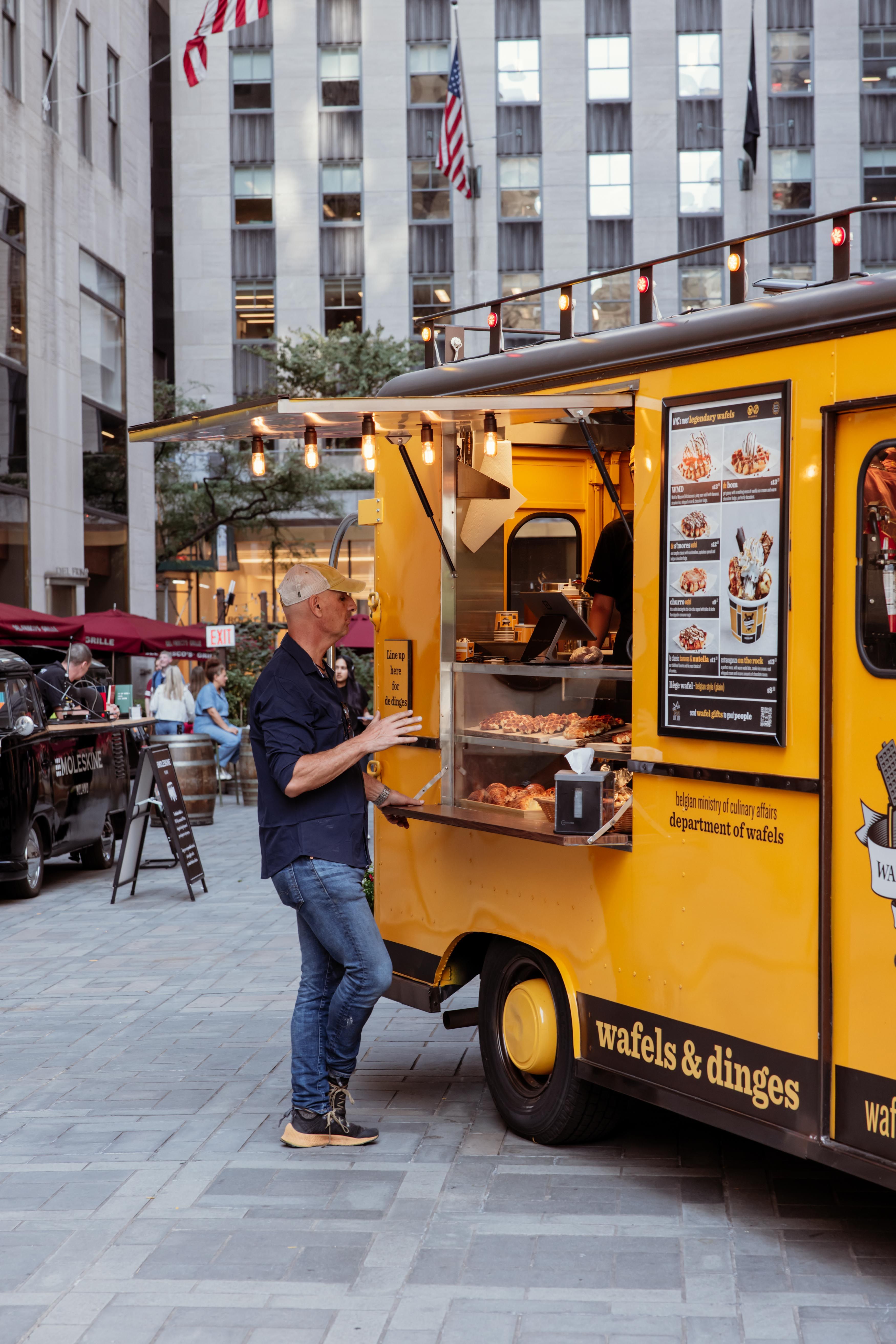 man standing at Wafles & Dinges Truck