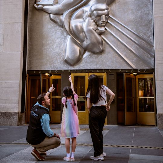 Guardian, child, and tour guide on the Rockefeller Center Jr. Tour