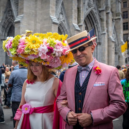 Woman and man attend the Easter Bonnet Festival