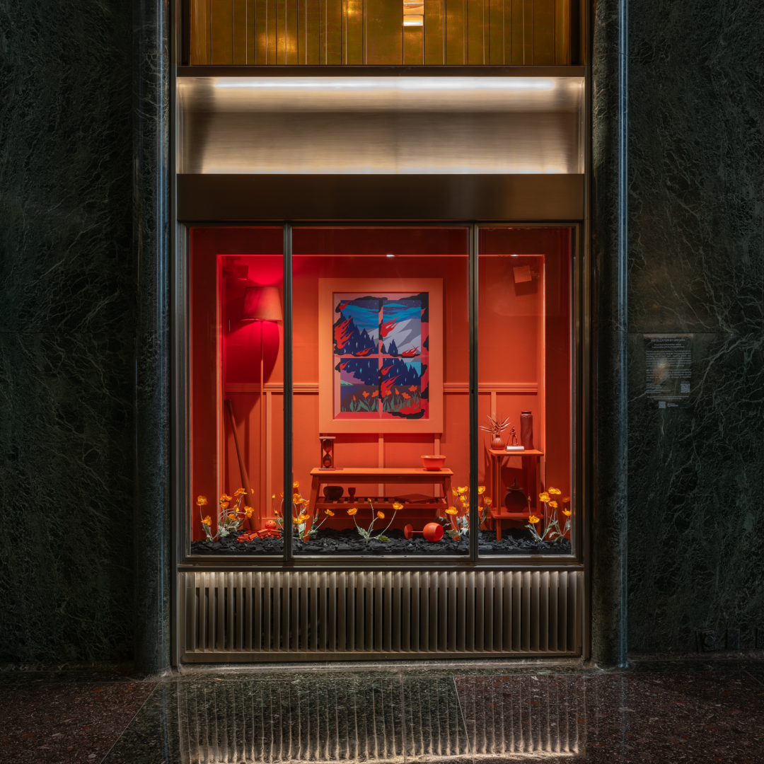 A glass display of artist Greg Ito's work at Rockefeller Center