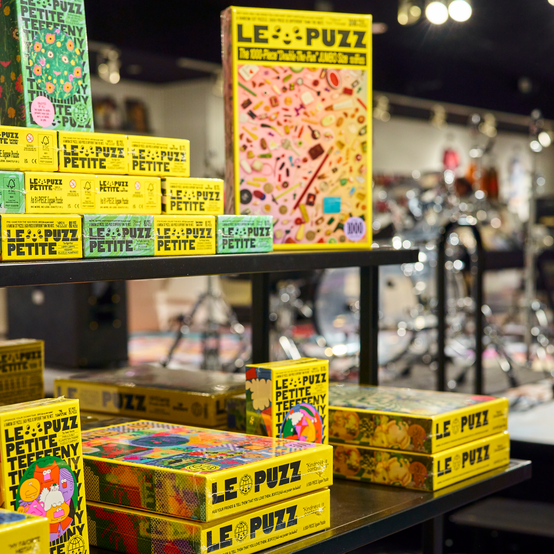 Various boxes of puzzles on a shelf at Rough Trade