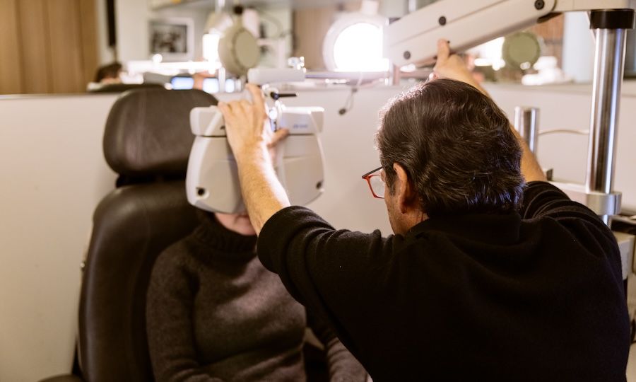 Dr. Mitch Cassel of Studio Optix examining a patient's eyes