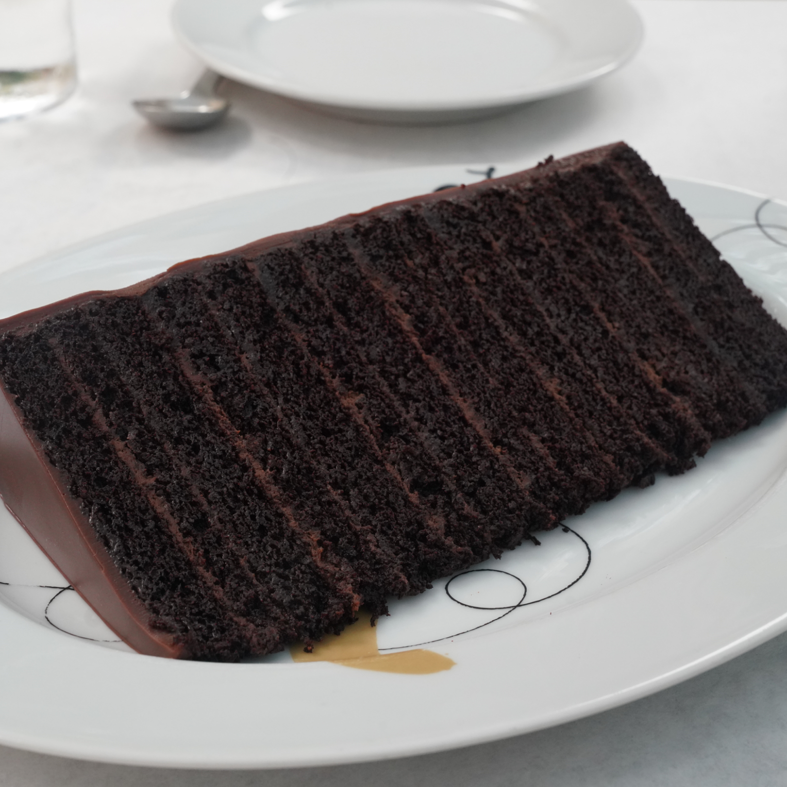 A slice of Jupiter's 30 Rock Cake on a plate