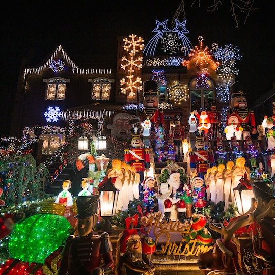 House covered in holiday lights and Christmas decorations