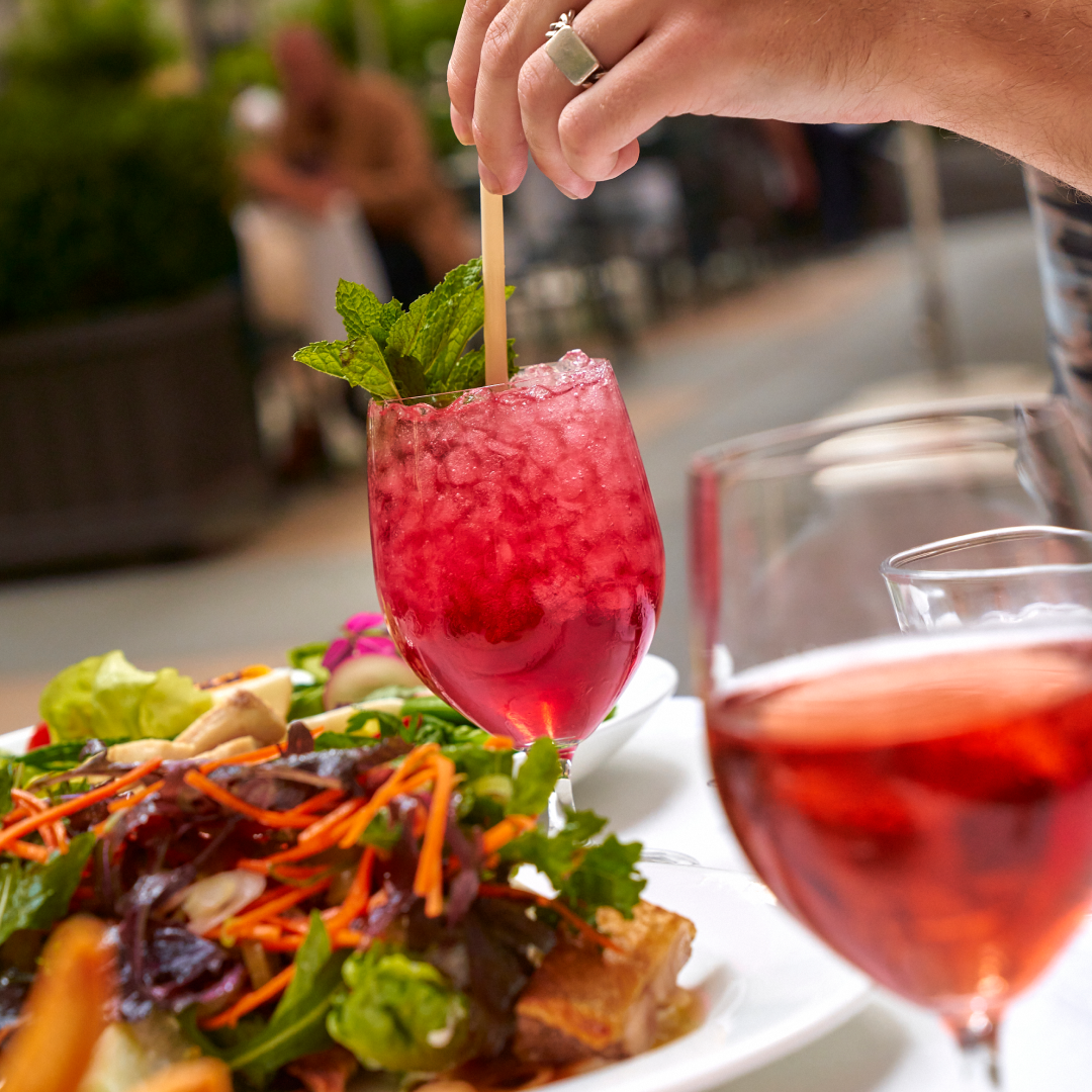 A glass of wine and a spritz cocktail from Le Rock at Rockefeller Center