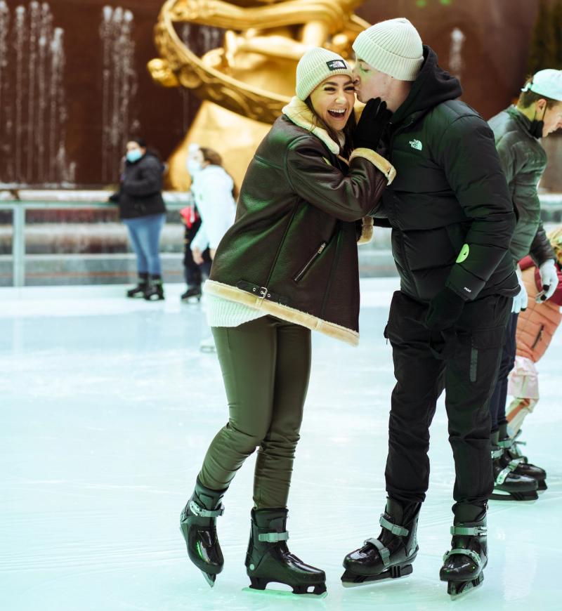 A couple skating on The Rink at Rockefeller Center