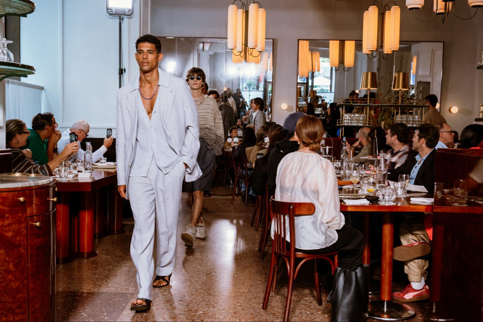 Models walking through restaurant