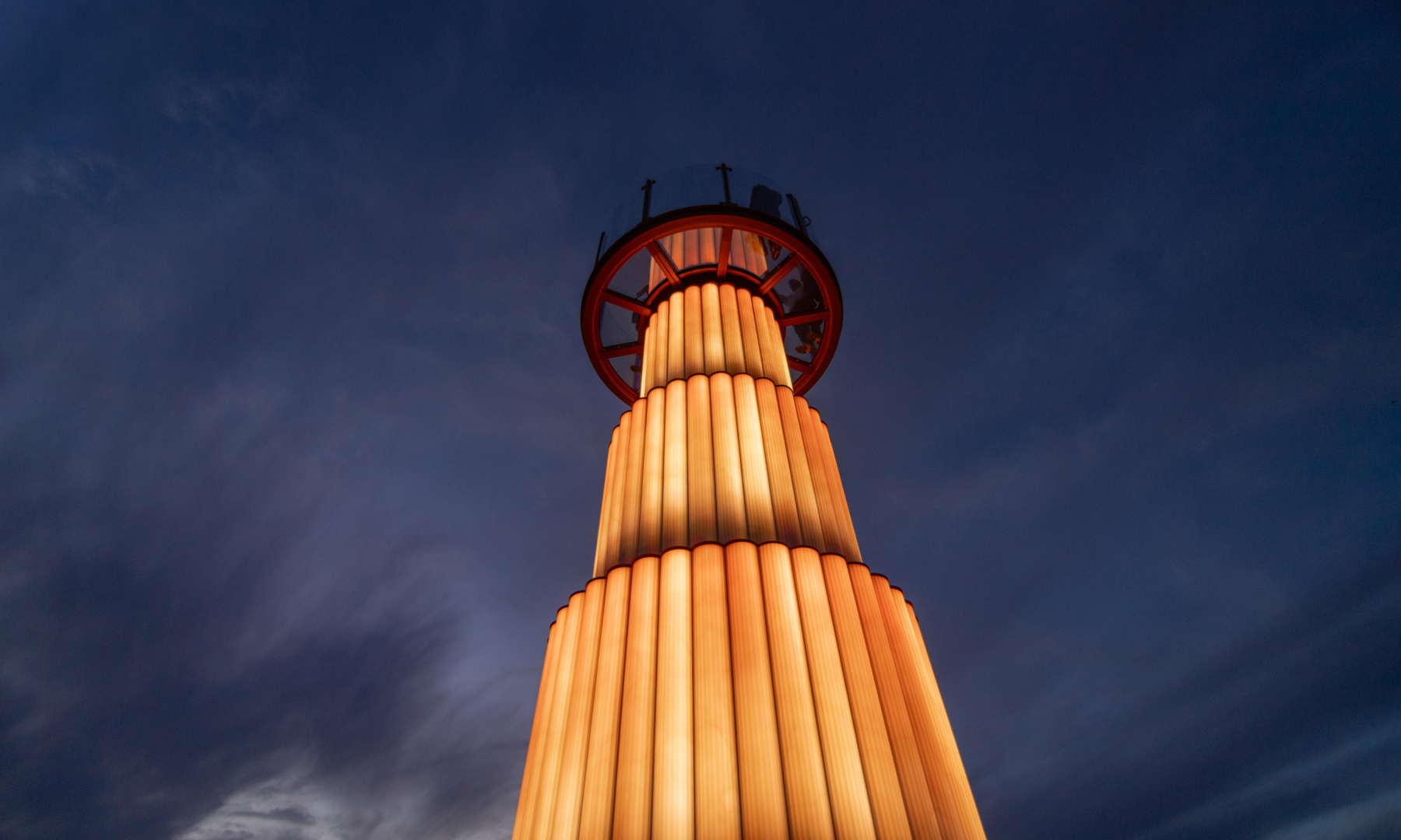 Skylift's base illuminated in a yellow-gold light