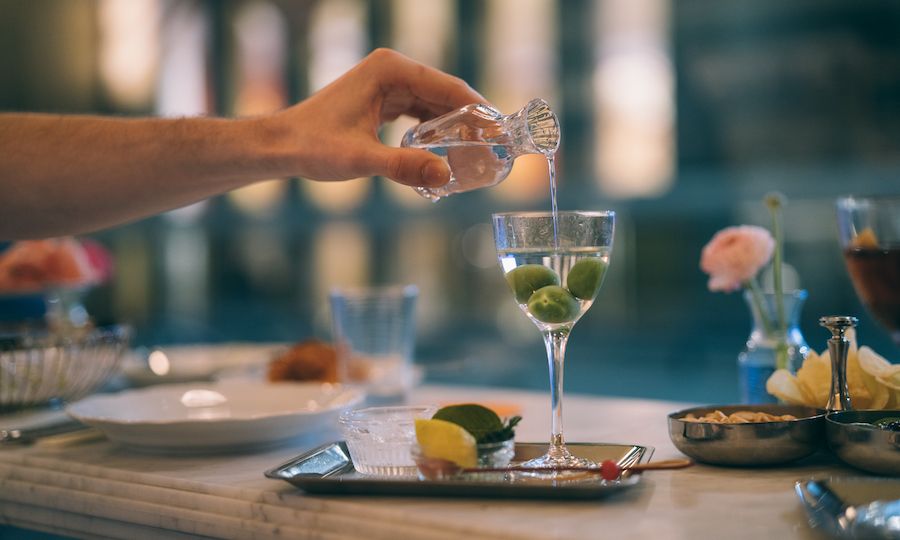 Hand pouring the Rockefeller Martini at Lodi