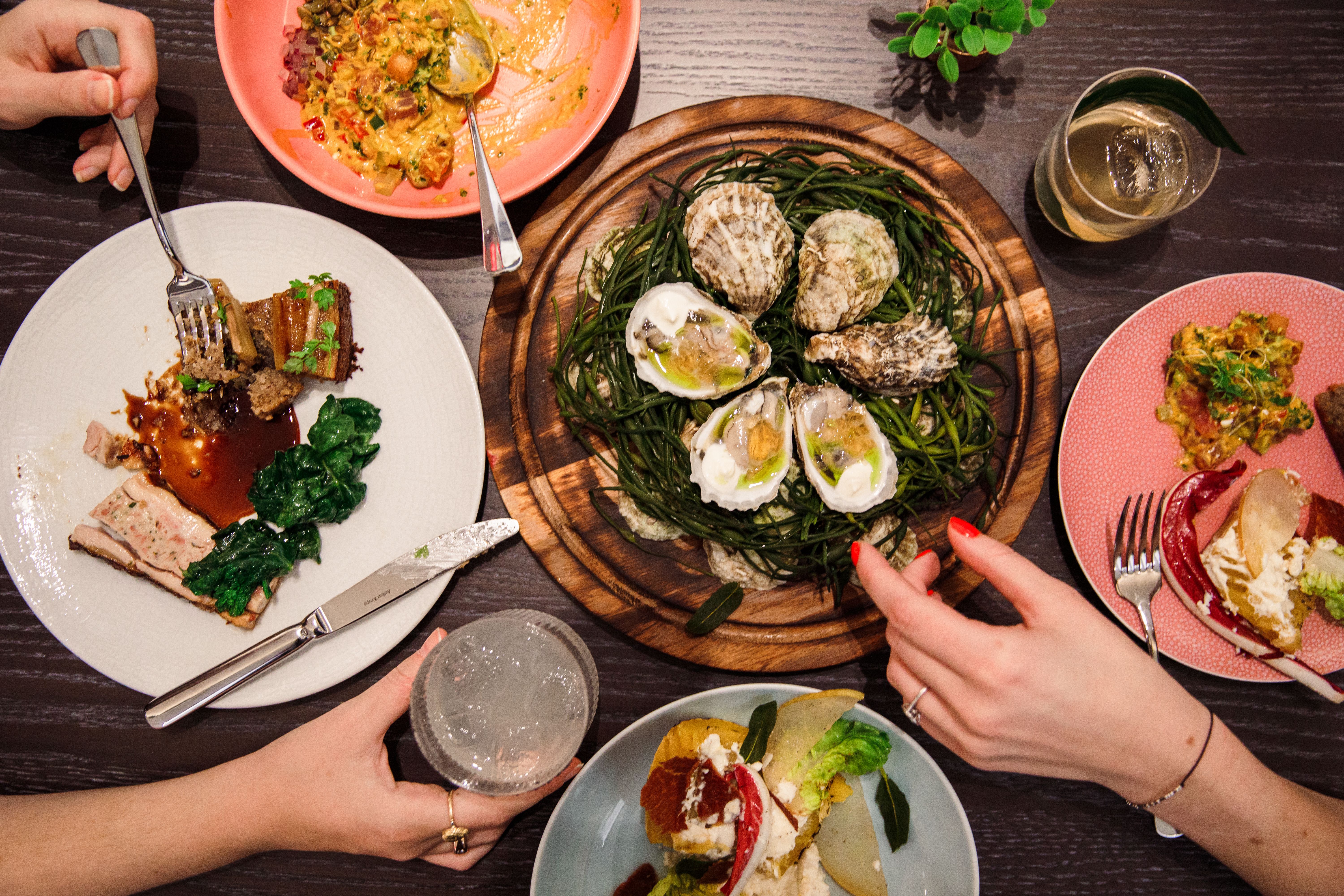 Plates of food from Five Acres at Rockefeller Center