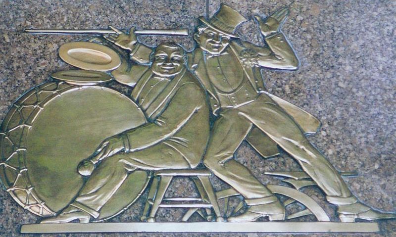 Acts from Vaudeville, a sculpture by Rene Paul Chambellan on display under the marquee and above 1260 Avenue of the Americas entrance.
