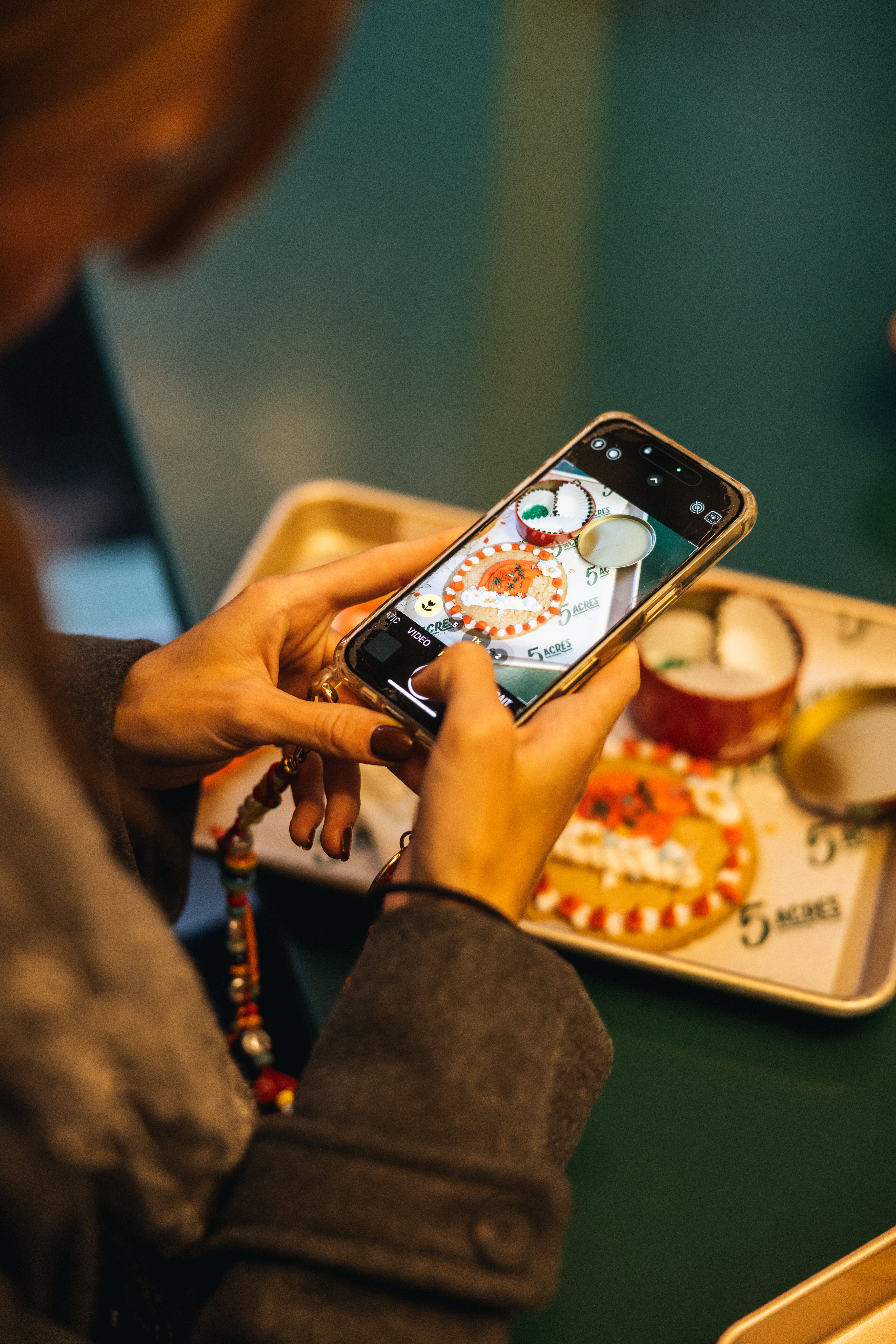 Girl taking a photo of a cookie