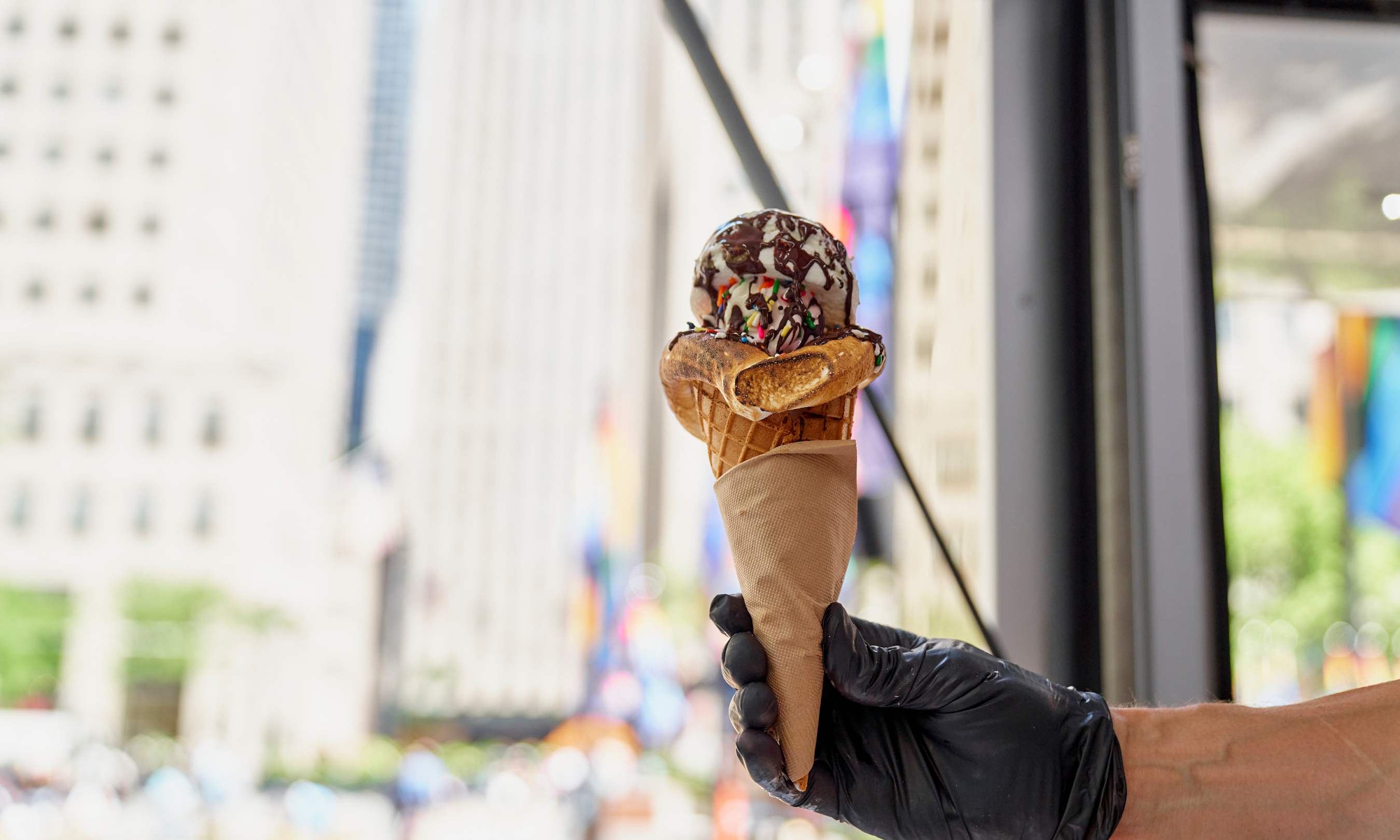 Hand holding an ice cream cone from Glace at Rockefeller Center