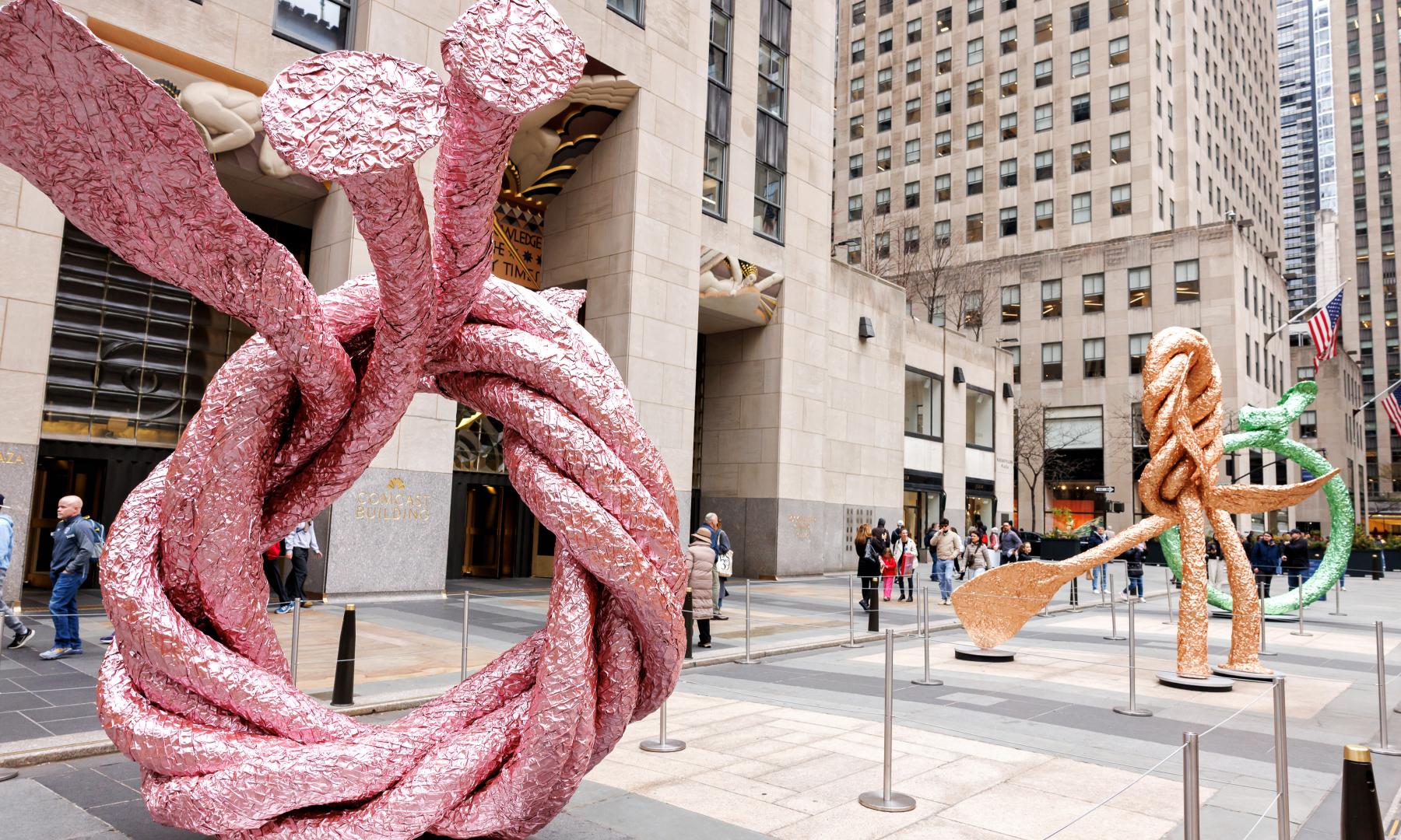 Artist John Chamberlain's pink FIDDLERSFORTUNE sculpture on Center Plaza at Rockefeller Center